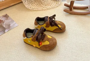 Girls' yellow suede trainer shoes featuring colorful flower embroidery and soft soles