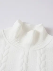 Detailed macro view of white cable knit sweater showcasing the ribbed high neck collar texture