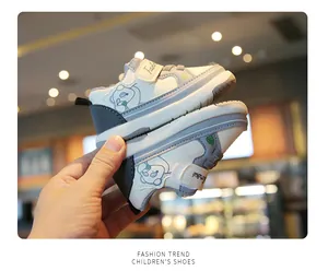 Close-up of stylish baby walking shoes with cute bear pattern and velcro straps