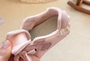 Macro view of pink girls' casual sneaker interior with soft lining and lace trim