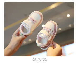 Detailed view of soft-soled pink and white toddler walking shoes for infants aged 1 to 3 years