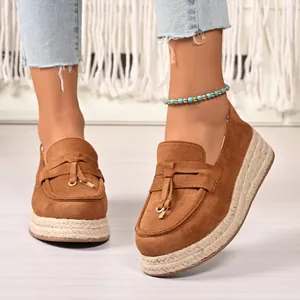 Womens brown suede platform loafers featuring tassel detail and jute-wrapped sole