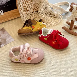 Detailed view of colorful toddler sneakers featuring cute 3D floral embroidery details.