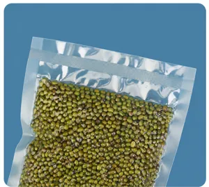Close-up of a clear vacuum sealer bag containing green beans, showing its airtight seal