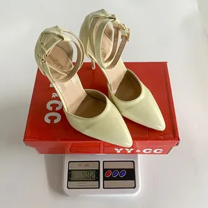 Beige pointed-toe stiletto heels on an electronic scale to show product weight detail