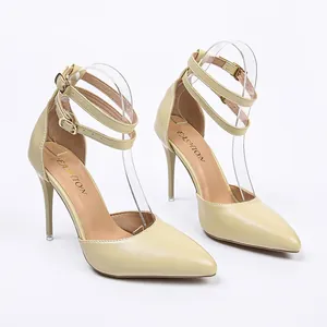 Elegant beige pointed toe pumps with triple ankle straps and stiletto heels.