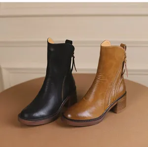 Pair of chunky heel ankle boots in black and vintage brown leather with side zipper