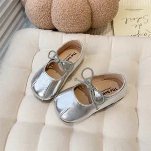 Detail view of silver French style Mary Jane flats for girls featuring a soft sole