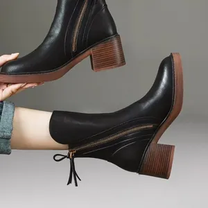 Women's vintage black leather ankle boots with wooden thick block heels and side zipper