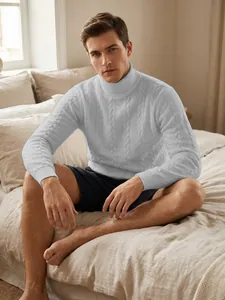 Close-up of men's white cable knit turtleneck sweater showing texture and fit