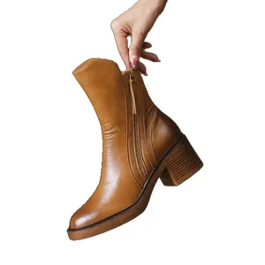 Stylish brown chunky heel ankle boots featuring vintage burnished leather and a side zipper