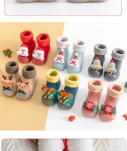 Cozy Christmas themed fleece-lined baby walker socks in various colorful festive designs