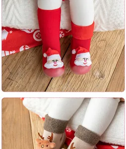 Close-up of festive Christmas baby walker shoes with Santa and reindeer plush details