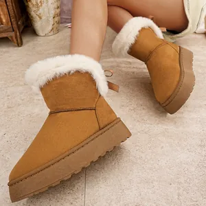 Botas de nieve con plataforma marrón con forro de piel sintética blanca y lazo en la espalda