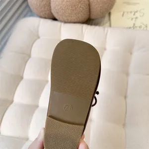 Close-up of the durable non-slip rubber sole on a girls' French style Mary Jane shoe