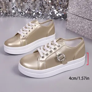 Gouden damesplateau-sneakers met strass-gesp en een dikke zool van 4 cm