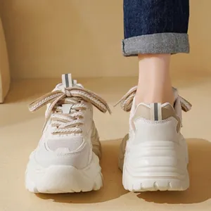 Fashionable women's thick sole platform dad sneakers in white and beige colors