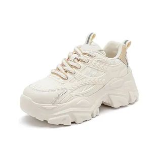 Stylish women's chunky dad sneakers with thick platform soles in cream white finish