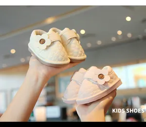 Detail shot of infant walking shoes with soft quilted leather and a cute flower