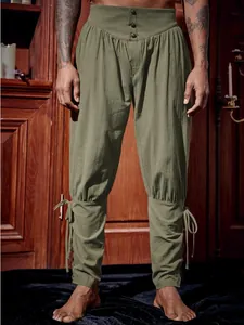 Detailed macro view of men's olive green vintage pirate pants with ankle-strap lacing decoration