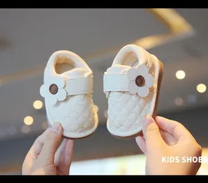 Premium quilted white baby walking shoes with flower decoration and soft anti-slip soles