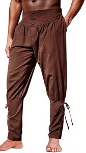 Detail of men's retro pirate style pants with lace-up ankle cuffs and pleated waist