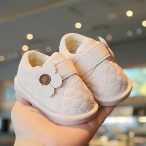 Pink quilted baby girl walking shoes with flower accent and soft non-slip sole