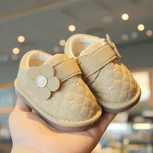 Beige toddler girl walking shoes featuring quilted heart pattern and 3D flower decoration