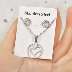 Stainless steel jewelry set with hollow heart pendant necklace and matching stud earrings