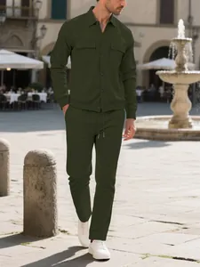 Lifestyle shot of men's dark green corduroy casual two-piece set in an outdoor setting