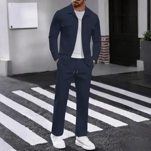 Modern men's navy blue corduroy set with long sleeve button-up shirt and matching trousers.