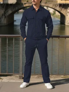Detailed view of navy blue corduroy two-piece set with button-down shirt and pants