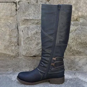 Side view of women's navy blue tall riding boots with zipper and cord detail