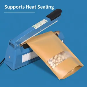 Manual blue impulse heat sealer machine sealing a brown kraft paper pouch with clear window