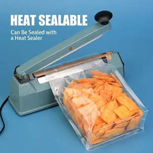 Clear octagonal stand-up food storage bag being sealed with an industrial impulse sealer