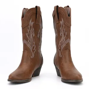 Detailed side view of fashionable women's vintage brown embroidered western cowboy boots
