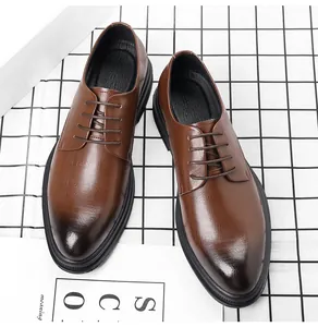 Detailed view of brown pointed-toe Oxford shoes with gradient texture for business wear