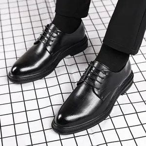 Elegant black British style business dress shoes with pointed toe on grid pattern floor