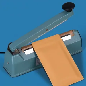 Professional manual impulse heat sealer sealing a brown kraft paper food packaging bag