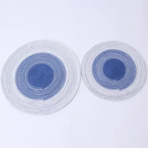 Detailed view of blue and white gradient circular woven placemats for home dining table