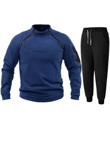 Close-up of blue coral fleece pullover set with unique shoulder zippers and black joggers