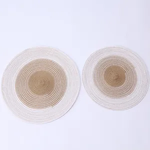 Detailed view of Nordic style gradient woven placemats in brown and white cotton yarn
