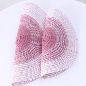 Detailed macro view of a Nordic style gradient pink woven cotton yarn placemat texture