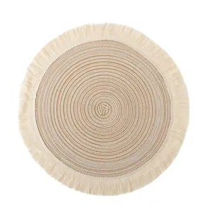 Round woven cotton placemat with elegant fringe tassels in Nordic style