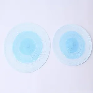 Nordic style gradient blue and white circular woven cotton placemats for elegant dining table