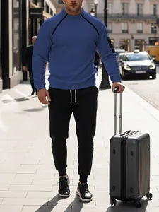Casual men's winter blue long sleeve fleece sweatshirt and black joggers tracksuit set