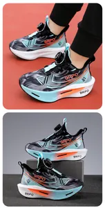 Close-up detail of boys' athletic shoes featuring a convenient rotary buckle closure system.