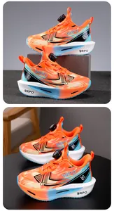 Vibrant orange boys' breathable sneakers featuring a modern rotary buckle closure system