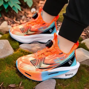 Vibrant orange boys' sports shoes with a rotary buckle, perfect for outdoor play activities