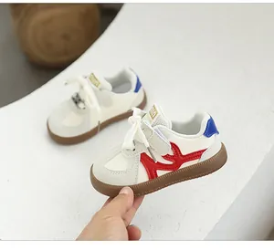 Close-up of lightweight toddler sneakers with soft soles and red wave pattern detail